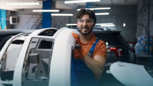 man-holding-up-car-part-ready-for-powder-coating